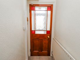 A door with glass panels in a hallway at Hardys House in Alnwick