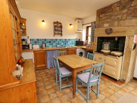A kitchen with table and chairs at Lavender Cottage (Bailiffgate) Alnwick