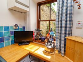 A kitchen with a kettle and bread box at Lavender Cottage (Bailiffgate) Alnwick