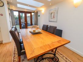 A dining room with a wooden table and chairs at Alnbank in Alnmouth