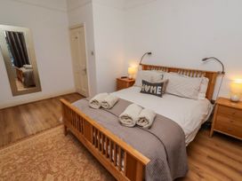 A bedroom with a bed and bedside tables at Alnbank in Alnmouth