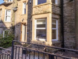 A house exterior with a bench and plants at Alnbank in Alnmouth