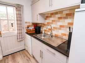 A kitchen with a sink and countertop at Heather Cottages - Brent Goose in Bamburgh