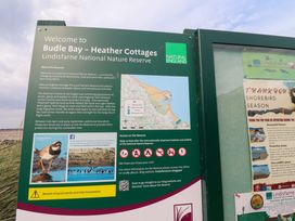 A nature reserve sign at Budle Bay - Heather Cottages in Bamburgh
