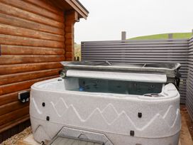 A hot tub in an outdoor area at Heather Cottages - Brown Owl, Bamburgh