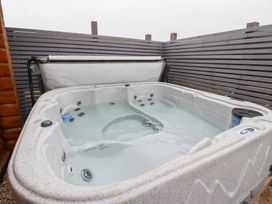 A hot tub in an outdoor area at Heather Cottages - Brown Owl in Bamburgh