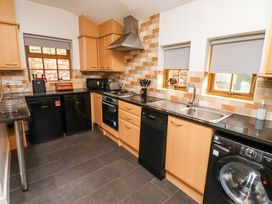 A kitchen with appliances and countertops at Heather Cottages - Grey Seal in Bamburgh