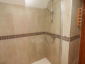 A shower with tiles at Heather Cottages - Grey Seal in Bamburgh