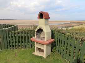 A barbecue grill in an outdoor area at Heather Cottages - Grey Seal Bamburgh