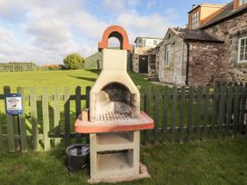 A barbecue grill in an outdoor area at Heather Cottages - Plover in Bamburgh