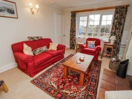 A living room with two sofas and a coffee table at St Marys Cottages No4 Low Newton-by-the-Sea