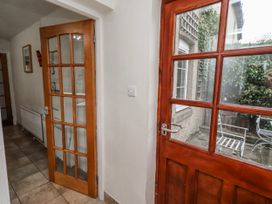 A hallway with a door and window at St Marys Cottages No4 Low Newton-by-the-Sea