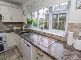 A kitchen with a sink and window at St Marys Cottages No4 Low Newton-by-the-Sea