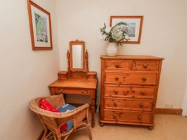 A bedroom corner with a dressing table and a chest of drawers at St Marys Cottages No4 Low Newton-by-the-Sea