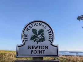 A sign for The National Trust at Newton Point in Low Newton-by-the-Sea