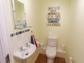 A bathroom with a toilet and sink at Sugar Sands in Longhoughton