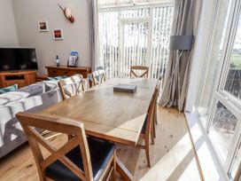 A dining room with a table and chairs at Red Fox in Lucker