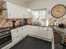 A kitchen with cabinets and appliances at Red Fox in Lucker