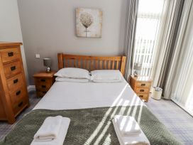 A bedroom with a bed and bedside tables at Red Fox in Lucker