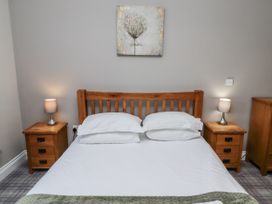 A bedroom with a bed and bedside tables at Red Fox in Lucker