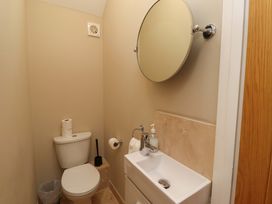A bathroom with a toilet and sink at Roe Deer in Lucker