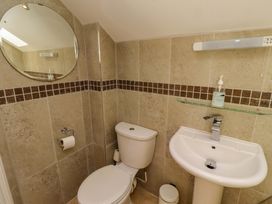 A bathroom with a toilet and sink at Roe Deer in Lucker