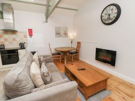 A living room with a sofa and coffee table at Chiff Chaff in Lucker