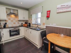 A kitchen with units and appliances at Greenfinch in Lucker