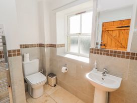 A bathroom with a toilet and sink at Greenfinch in Lucker