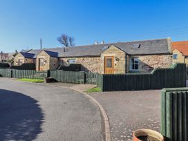 An outdoor view of buildings with a driveway at Greenfinch in Lucker