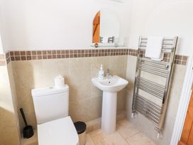A bathroom with a toilet and sink at Chaffinch in Lucker