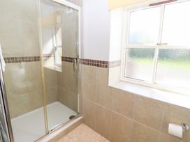 A bathroom with a shower and window at Chaffinch in Lucker
