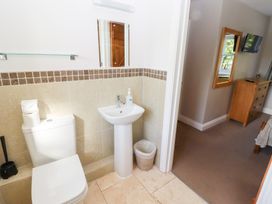 A bathroom with a toilet and sink at Chaffinch Lucker