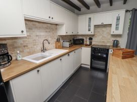 A kitchen with appliances and storage in Goldfinch Lucker
