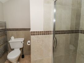 A bathroom with a toilet and shower at Goldfinch in Lucker