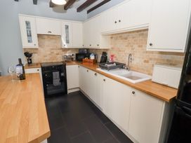 A kitchen with cabinets and appliances at Bullfinch in Lucker