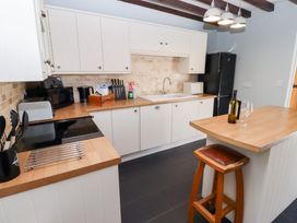 A kitchen with cabinets and appliances at Bullfinch in Lucker