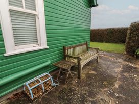 A bench and a lobster trap in an outdoor area at Armstrong Cottages No6 Bamburgh