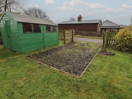 A shed and gravel area at Armstrong Cottages No6 Bamburgh