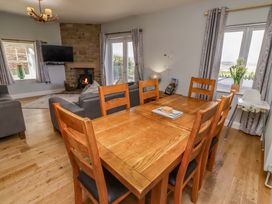 A dining room with a table and chairs at Pipistrelle in Bamburgh