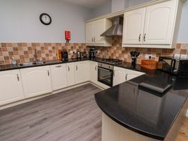 A kitchen with cabinets and appliances at Pipistrelle in Bamburgh