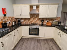 A kitchen featuring appliances and cabinets at Pipistrelle in Bamburgh
