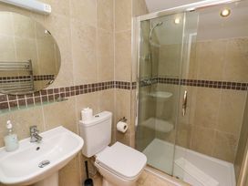 A bathroom with a shower and sink at Pipistrelle in Bamburgh