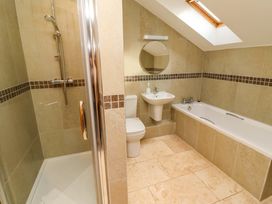 A bathroom with a shower, toilet, sink, and bathtub at Pipistrelle in Bamburgh