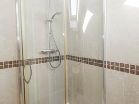 A shower with glass panels and tile in Goosander Bamburgh
