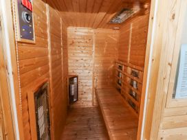 A sauna with wooden paneling and benches at Goosander in Bamburgh