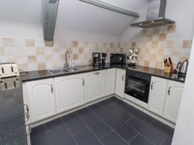A kitchen with appliances and cabinets at Old Mill (Lucker) in Lucker