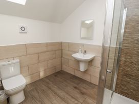 A bathroom with a shower and sink at Old Mill (Lucker) in Lucker