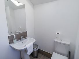 A bathroom with a sink and toilet at Old Mill (Lucker) Lucker