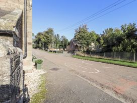A street view with buildings and trees at Old Mill (Lucker) Lucker